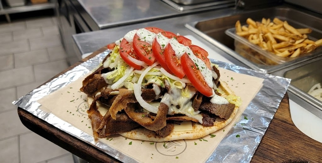 Cheese donair wrap on fresh pita with donair meat, tomato, onion and sweet sauce at Donair and Shawarma House Sherwood Park